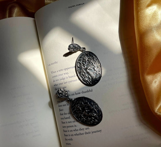 Silver, gold, shanakht, earrings, jhumka, pearls, diamondsExplore the Elegance of Time with Jamna Earrings
Lightweight Design for Every Occasion
The Jamna earrings are designed to be some of the lightest jewelry you can weaJamna